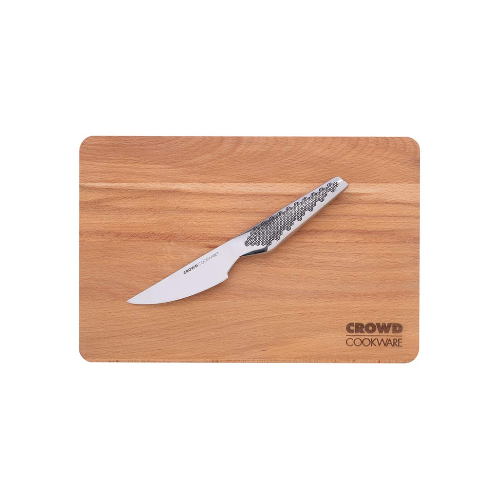 30 x 20 cm beech wood cutting board Crowd Cookware with Crowd Cookware logo and sloped edges with Crowd Cookware paring knife on top