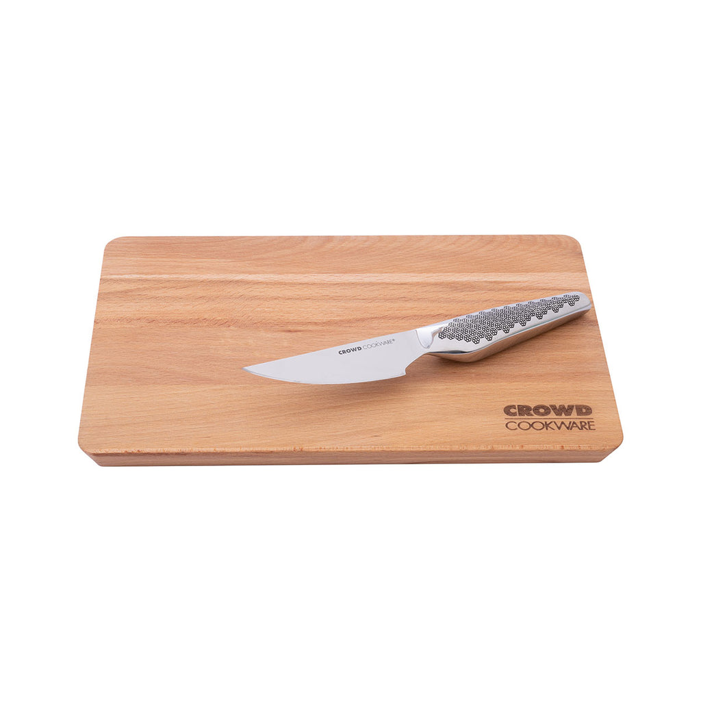 30 x 20 cm beech wood cutting board Crowd Cookware with Crowd Cookware logo and sloped edges with Crowd Cookware paring knife on top