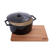 Beech wood rectangular cutting board 40x30 cm with sloped edges, recycled cast iron dutch oven from Crowd Cookware on top in black, and Crowd Cookware logo.